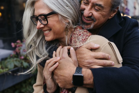 Embracing a future of joy and security: A couple celebrates the peace of mind that comes with a well-planned retirement, ensured by the stability of their annuity income.